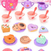 A pink and purple pretend play tea set featuring teapot, cups, and donuts for children.