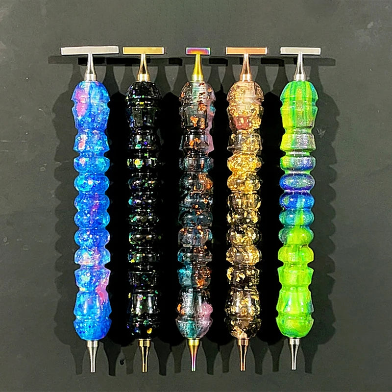 A display of colorful diamond painting pens with stainless steel tips, showcasing various iridescent and vibrant colors.