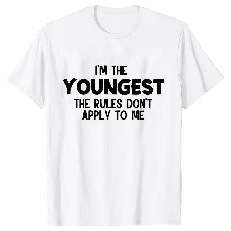 A white t-shirt with black text that reads I'm the youngest the rules don't apply to me