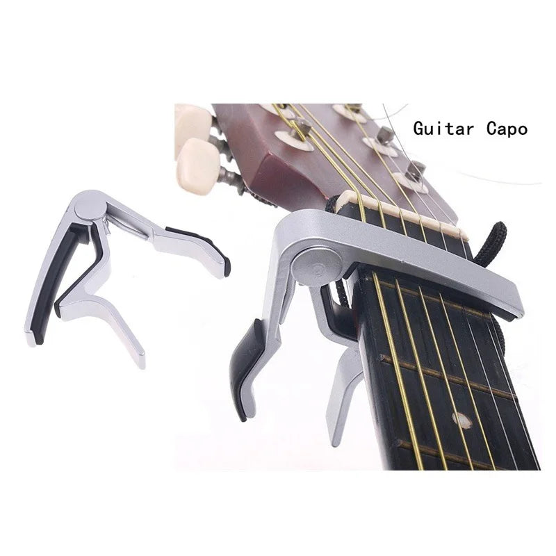 Silver aluminium alloy quick-release guitar capo clamped onto a guitar fretboard