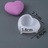 A pink silicone heart mold and a white heart-shaped container are shown with dimensions.