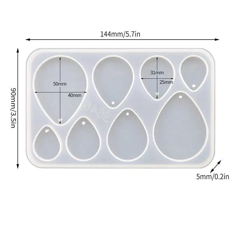 A white silicone mold set with multiple geometric shapes for making epoxy resin earrings and pendants.