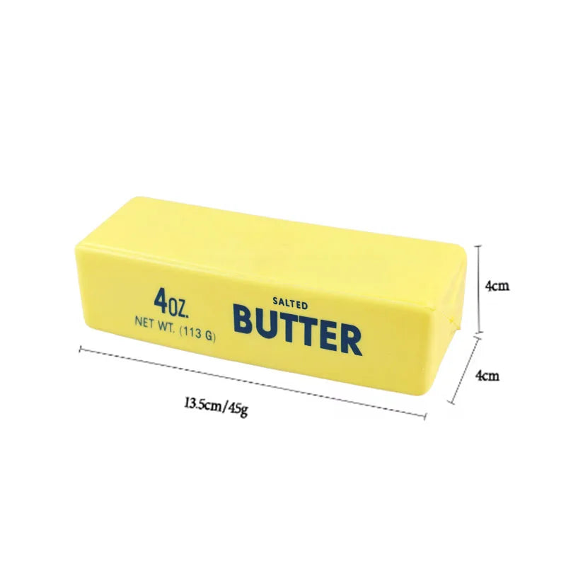 A yellow butter stick squishy fidget toy with salt butter labeling and dimension markings.