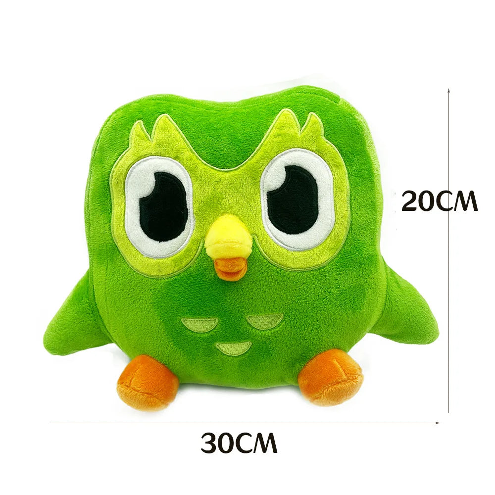 A soft green plush toy of Duo the Owl with large white eyes and orange feet.