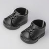 A pair of black Halloween pumpkin costume shoes for 17cm dolls.