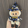 A cute doll wearing a Halloween pumpkin costume set with a witch hat and black fabric
