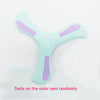 Light green foam boomerang flying disc with purple accents