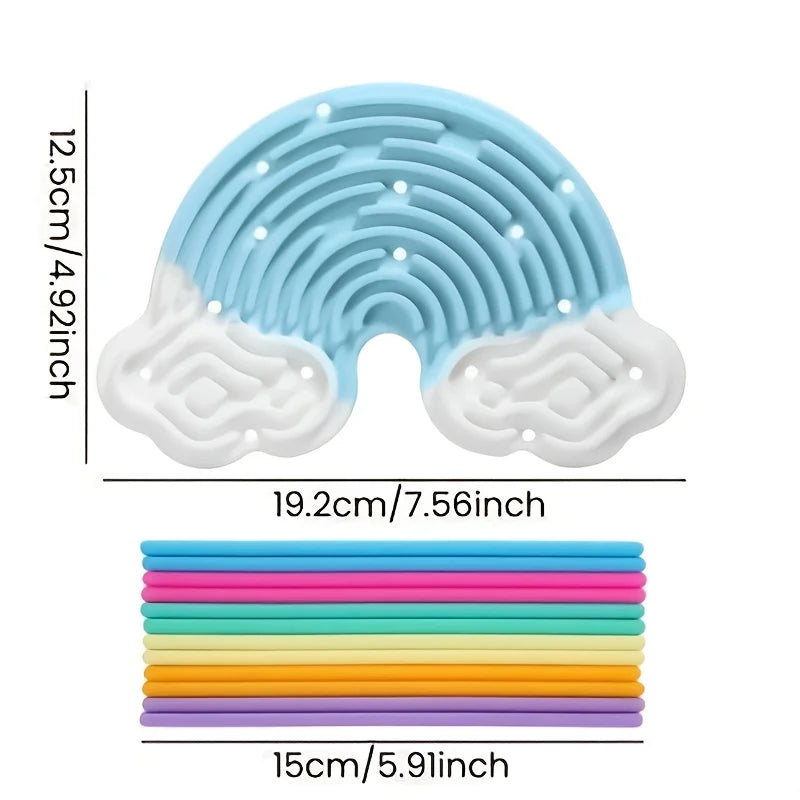 A silicone busy board featuring a blue wavy cloud shape with white accents and a stack of colorful silicone rings.