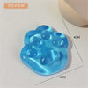 A light blue squishy toy shaped like a cat paw, used for stress relief or fidgeting.