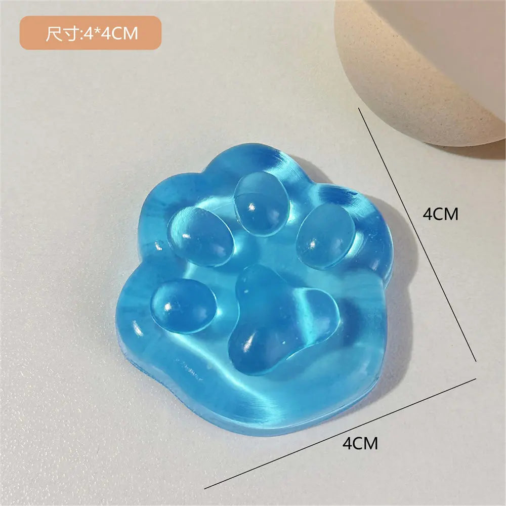 A light blue squishy toy shaped like a cat paw, used for stress relief or fidgeting.