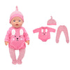 A pink doll outfit set featuring a hat, long-sleeved top, and striped pants.