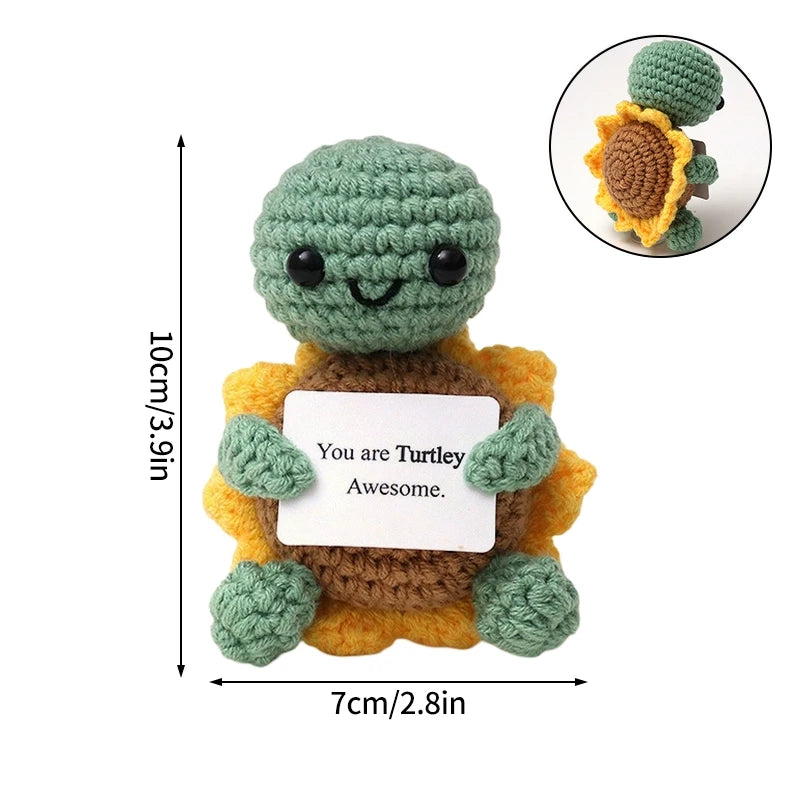 Handmade crochet turtle pocket hug doll in green and yellow with an inspirational slogan