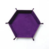 A purple hexagonal folding PU leather dice tray.