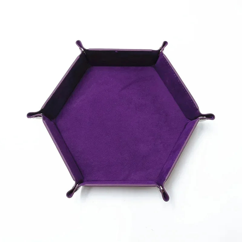 A purple hexagonal folding PU leather dice tray.