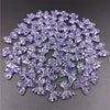 A pile of 20 clear purple acrylic bow beads for jewelry making