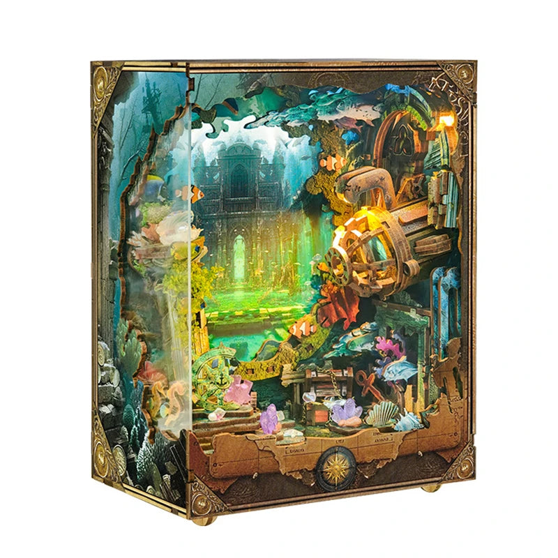 A decorative box featuring a diorama of an underwater world with plants, ruins, and glowing elements.