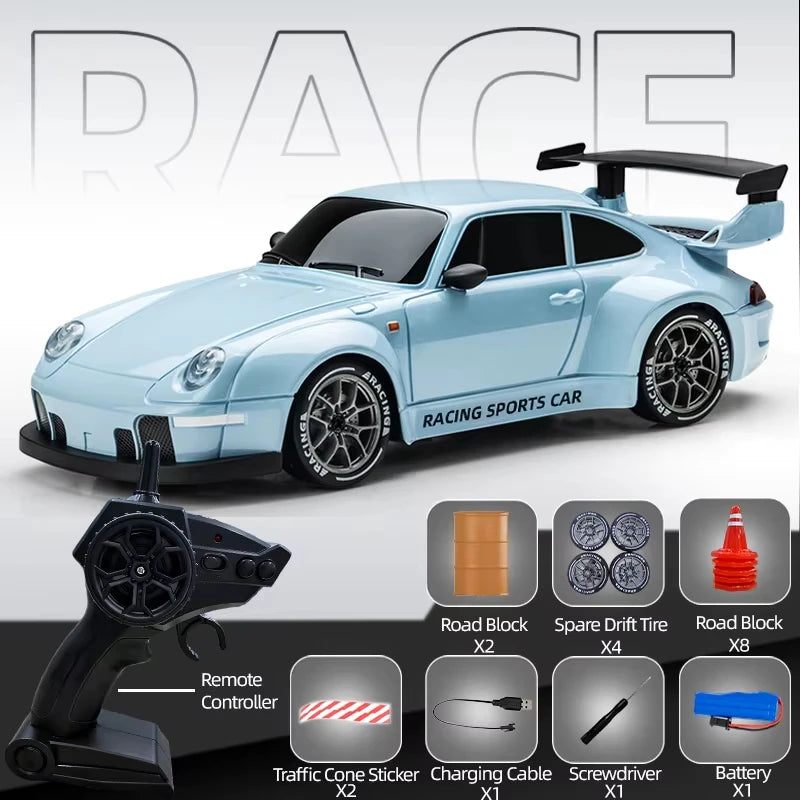 A light blue racing sports car model alongside various accessories like a remote controller and battery.