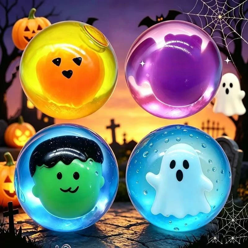 A collection of glowing squishy toys shaped like pumpkins, ghosts, and other Halloween figures against a dark background.