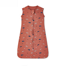 A sleeveless cotton baby sleeping bag sack in a terracotta color with a repeating pattern of small blue and white striped des