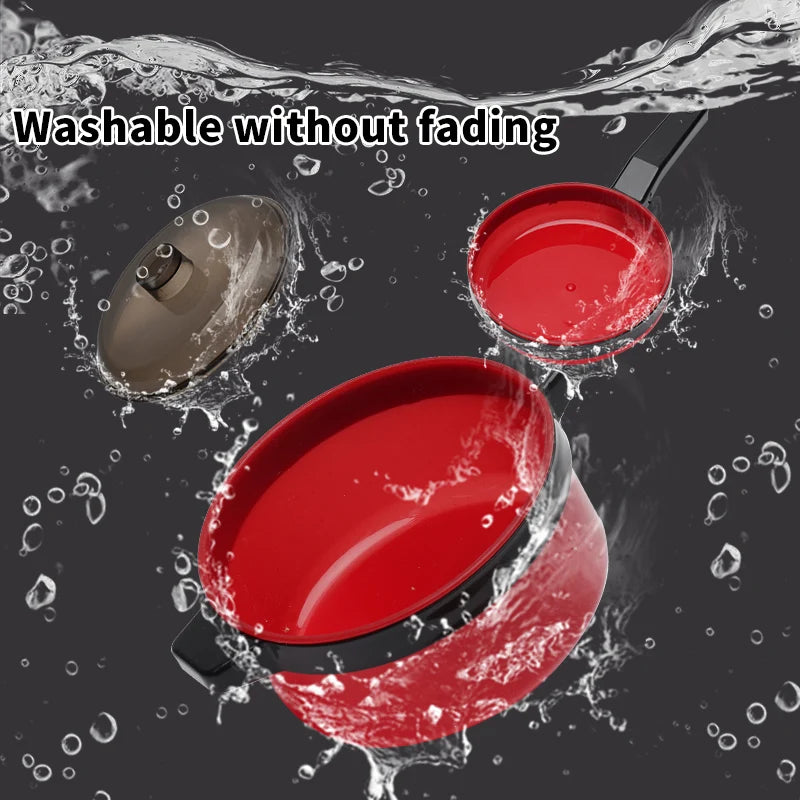 A red play kitchen cooking set with pots and pans is shown being washed without fading.