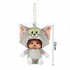 Gray cat plush cartoon charm with large ears and green eyes hanging from a chain