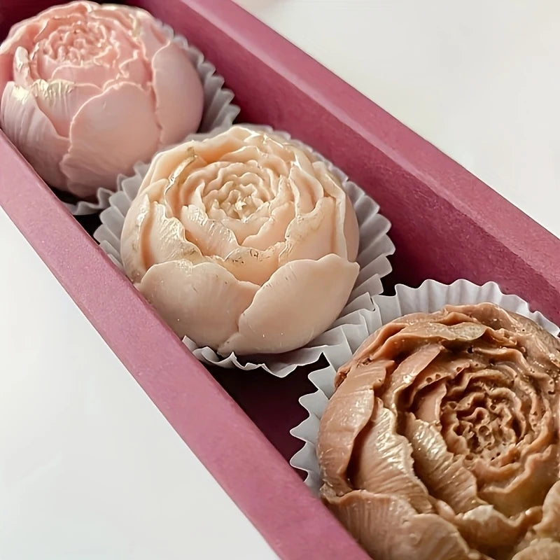 A set of realistic pink and beige rose silicone molds for candle, soap, and crafting are displayed in a pink box.
