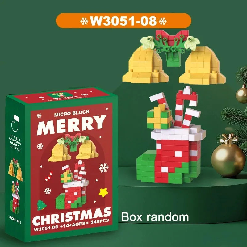A box of Christmas micro building blocks featuring Santa and reindeer figures on a green background.