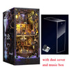 A wooden pirate ship book nook kit featuring a detailed diorama inside a box with a dust cover and music box.