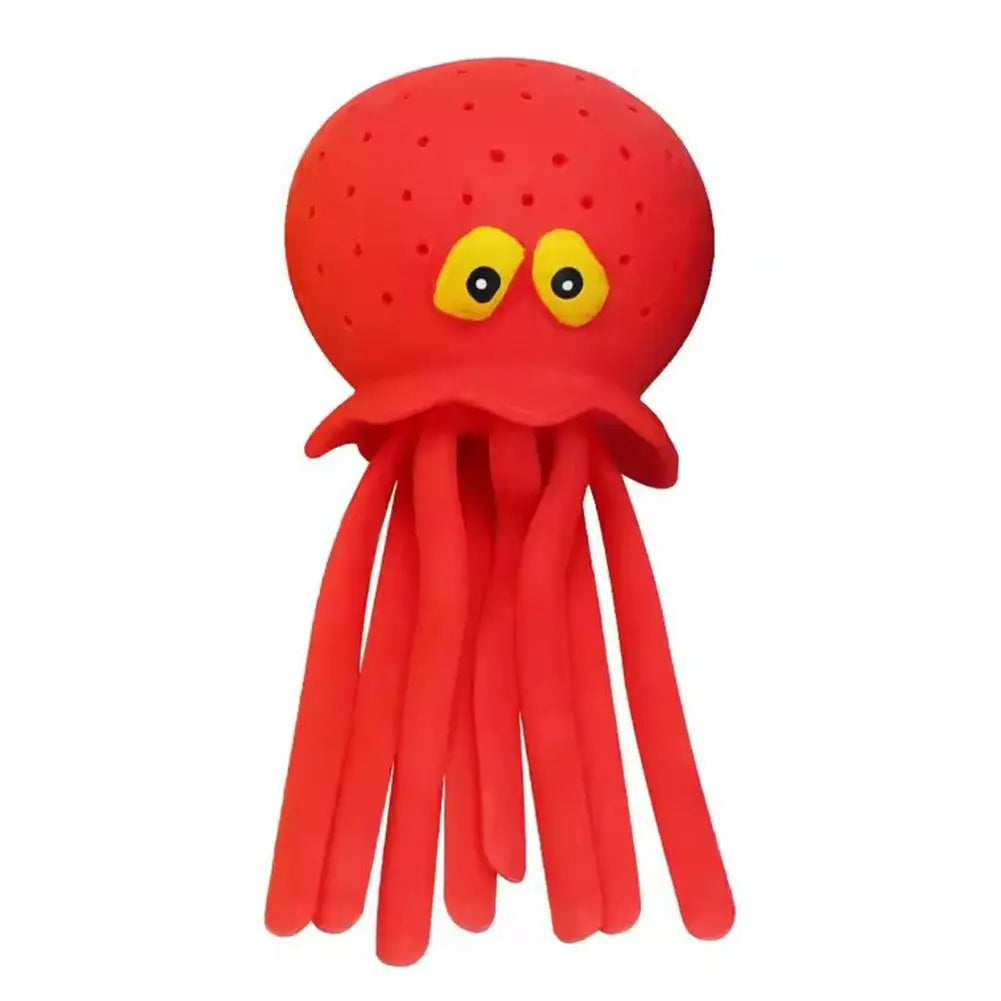 A bright red squeeze and soak octopus bath toy for toddlers with yellow eyes.
