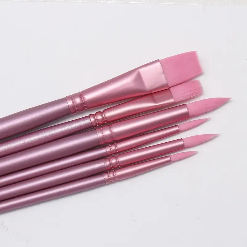 A set of six pink nylon paint brushes for watercolor and acrylic painting