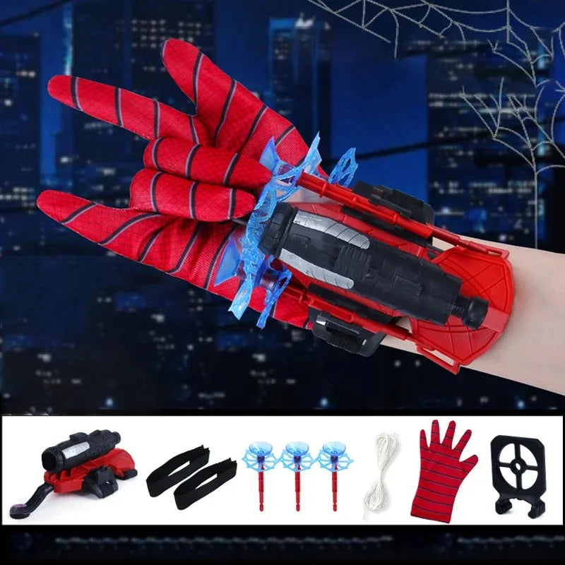 A red and black superhero launcher wrist toy set with suction cup darts shown against a city skyline background.