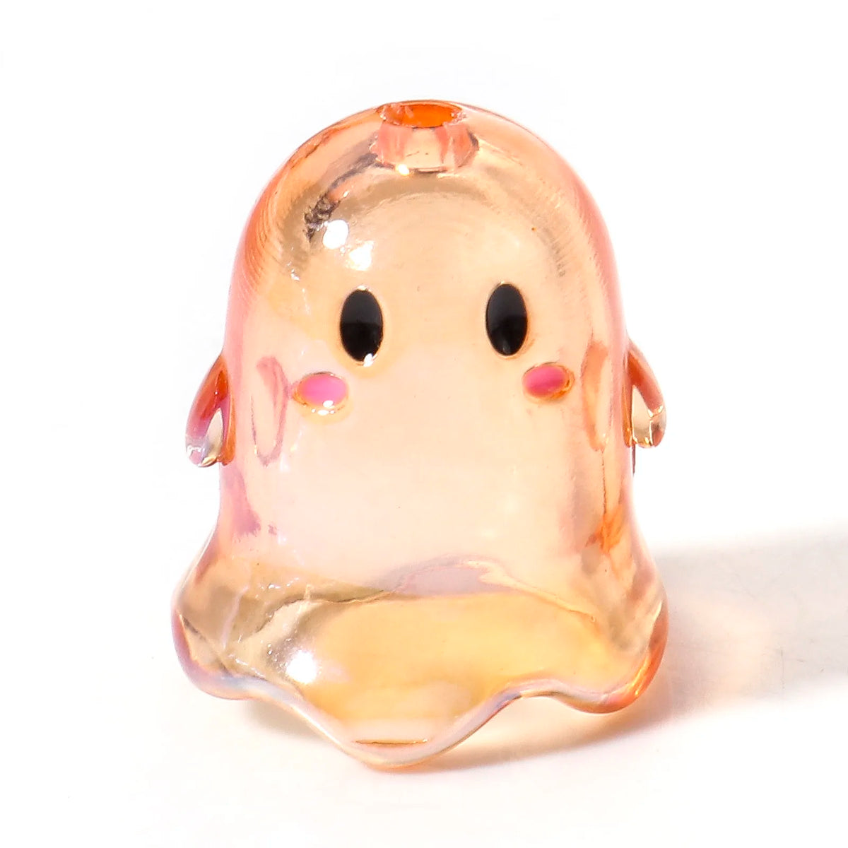 A translucent orange acrylic ghost bead with a small orange stud on top.
