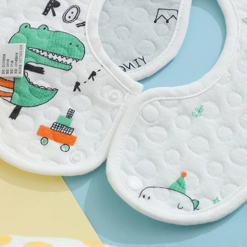 A set of three white quilted baby bibs featuring cute dinosaur and animal designs.
