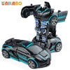 A black and teal transformable robot sports car toy with a robot figure attached.