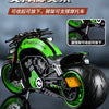 A detailed green and black die-cast motorcycle model with aftermarket exhaust components shown in a studio setting.