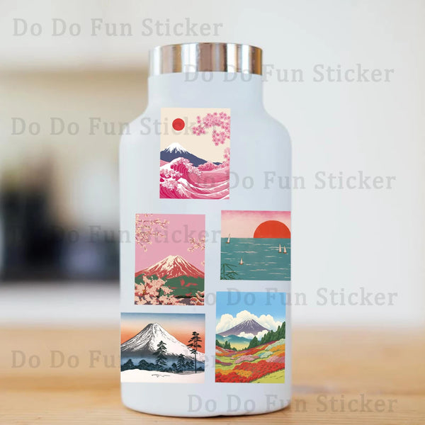 A white bottle with a label featuring pink cherry blossoms, a red sun, and Japanese mountain landscapes.
