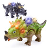 A green dinosaur toy with spiky features and glowing eyes is shown next to a dark gray dinosaur toy.