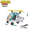 A metal model off-road vehicle and excavator engineering kit with yellow arms and silver construction parts.