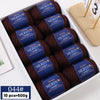 A box containing ten balls of dark brown merino wool thread yarn for knitting projects