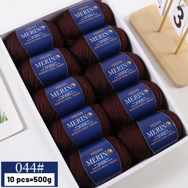 A box containing ten balls of dark brown merino wool thread yarn for knitting projects