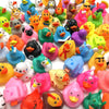 A collection of colorful mini rubber duckies party favors in various bright colors and designs.