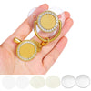 A hand holds a gold-toned baby pacifier and clip set with rhinestone accents.