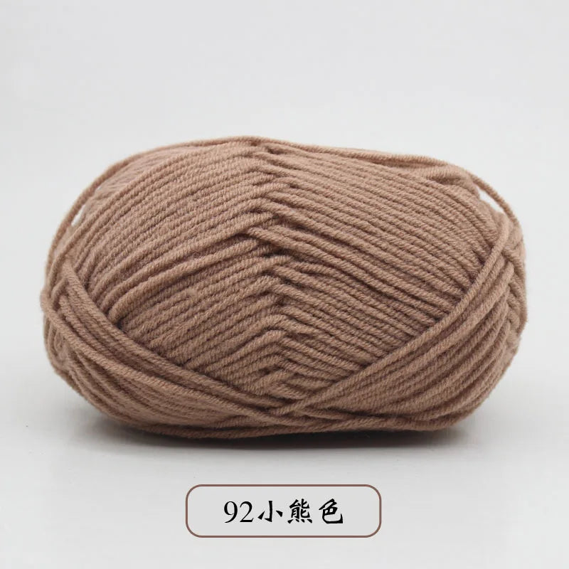 A ball of pre-dyed milk cotton yarn, soft 5-ply blended yarn for knitting and crochet.