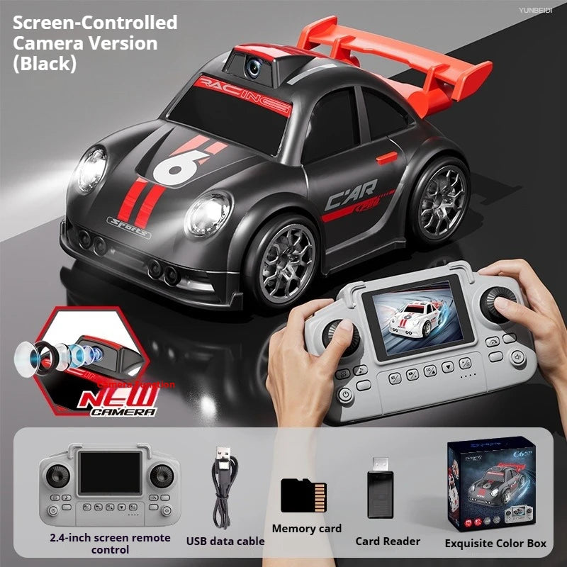 A black sports car RC model is shown with a remote control and camera setup for driving and filming.