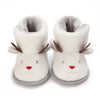 A pair of soft, white, animal-themed baby first walker shoes with ears and a nose.