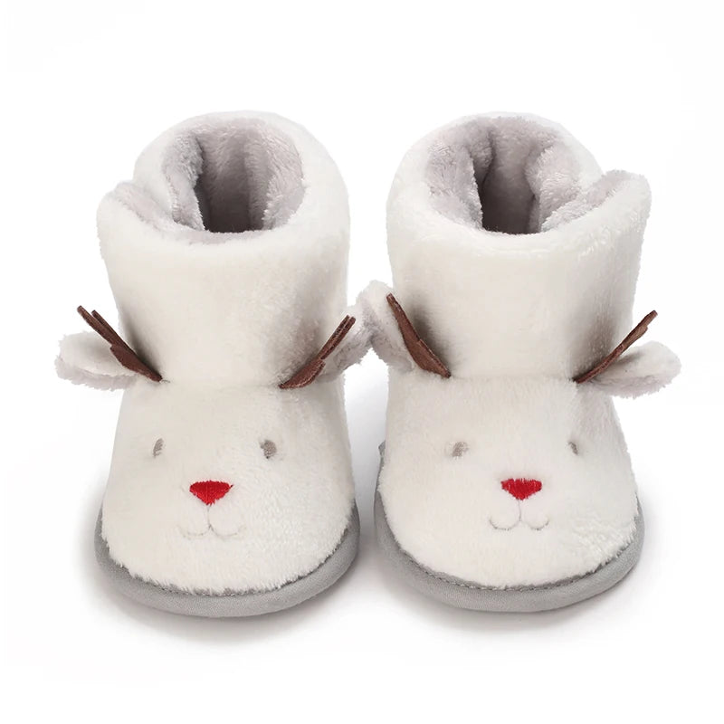A pair of soft, white, animal-themed baby first walker shoes with ears and a nose.