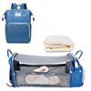 A blue backpack diaper bag featuring a built-in changing pad and storage for baby supplies.
