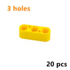 A yellow plastic piece with three holes, part of a 20-piece Technic liftarm beam set.