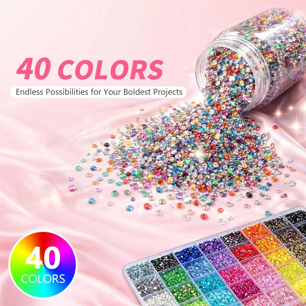 A collection of 40 colors of 3mm flatback resin jelly rhinestones and craft gems spilled onto a pink surface.