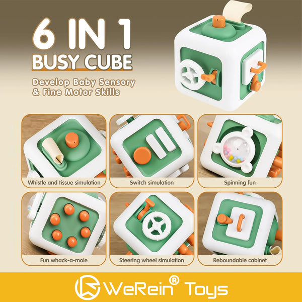 A green and white 6-in-1 busy cube toy showing various sensory functions like whistling, switching, spinning, and steering.
